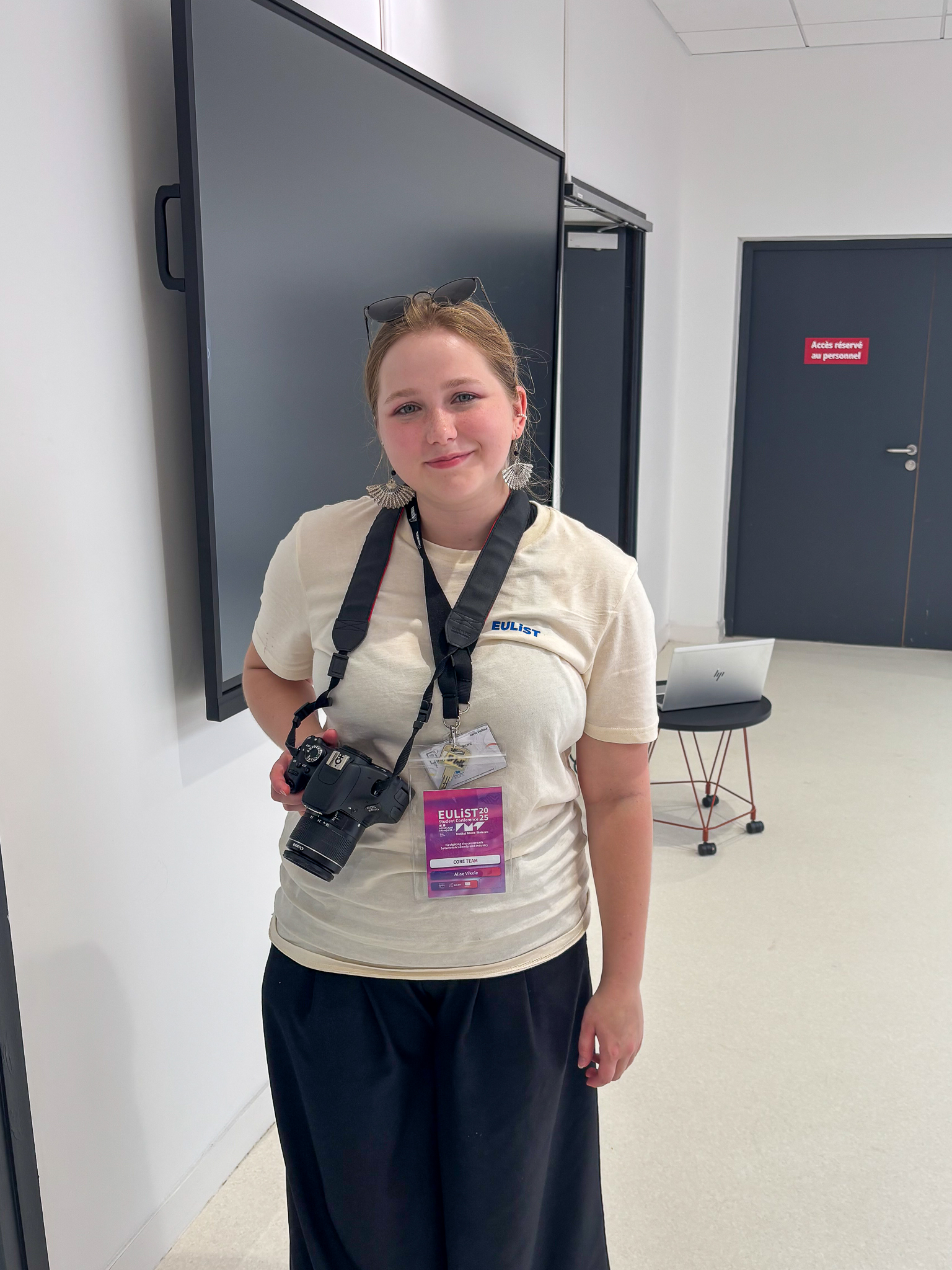 A JU student smiles and looks at the camera